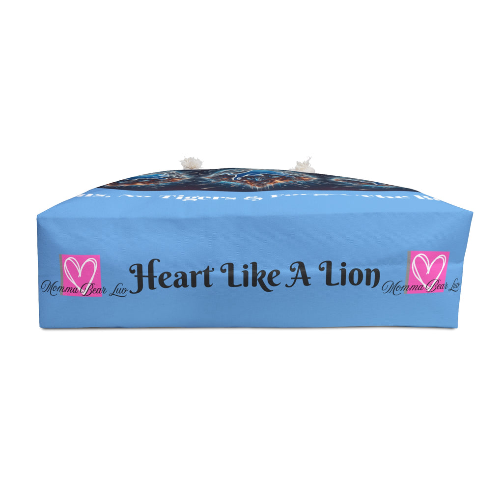 Blue pillow with 'Heart Like A Lion' text and logo on a white background