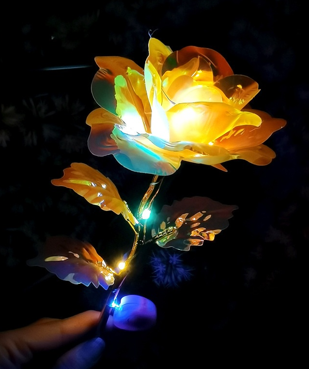 Decorative LED flower light on a dark background