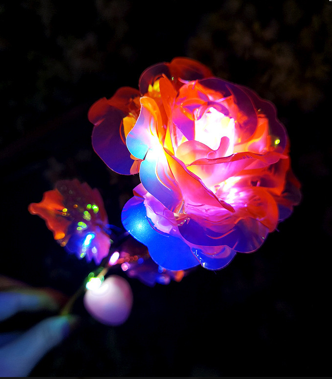 Colorful LED rose on a dark background