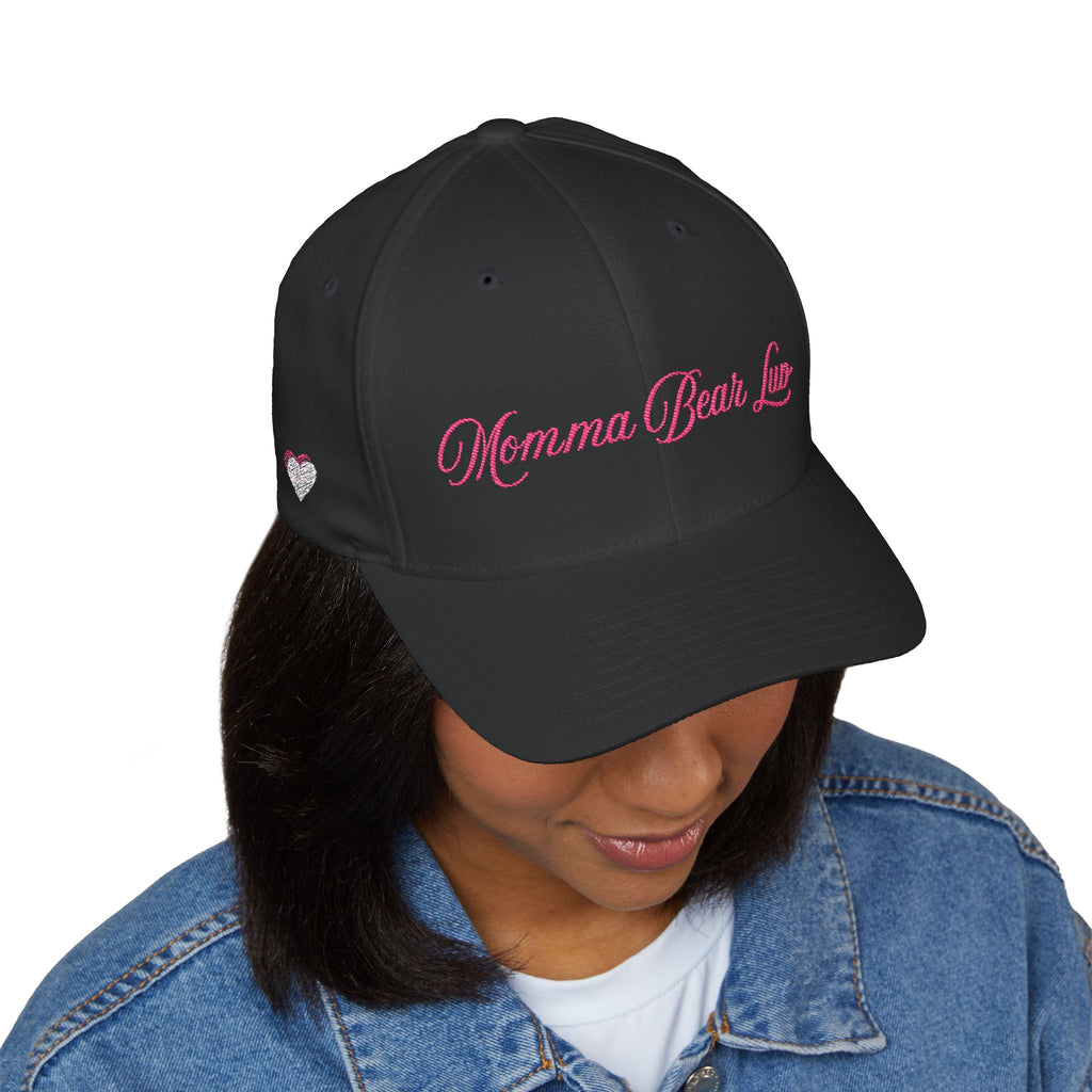 Person wearing a black cap with 'Myster mash productions' text on a white background