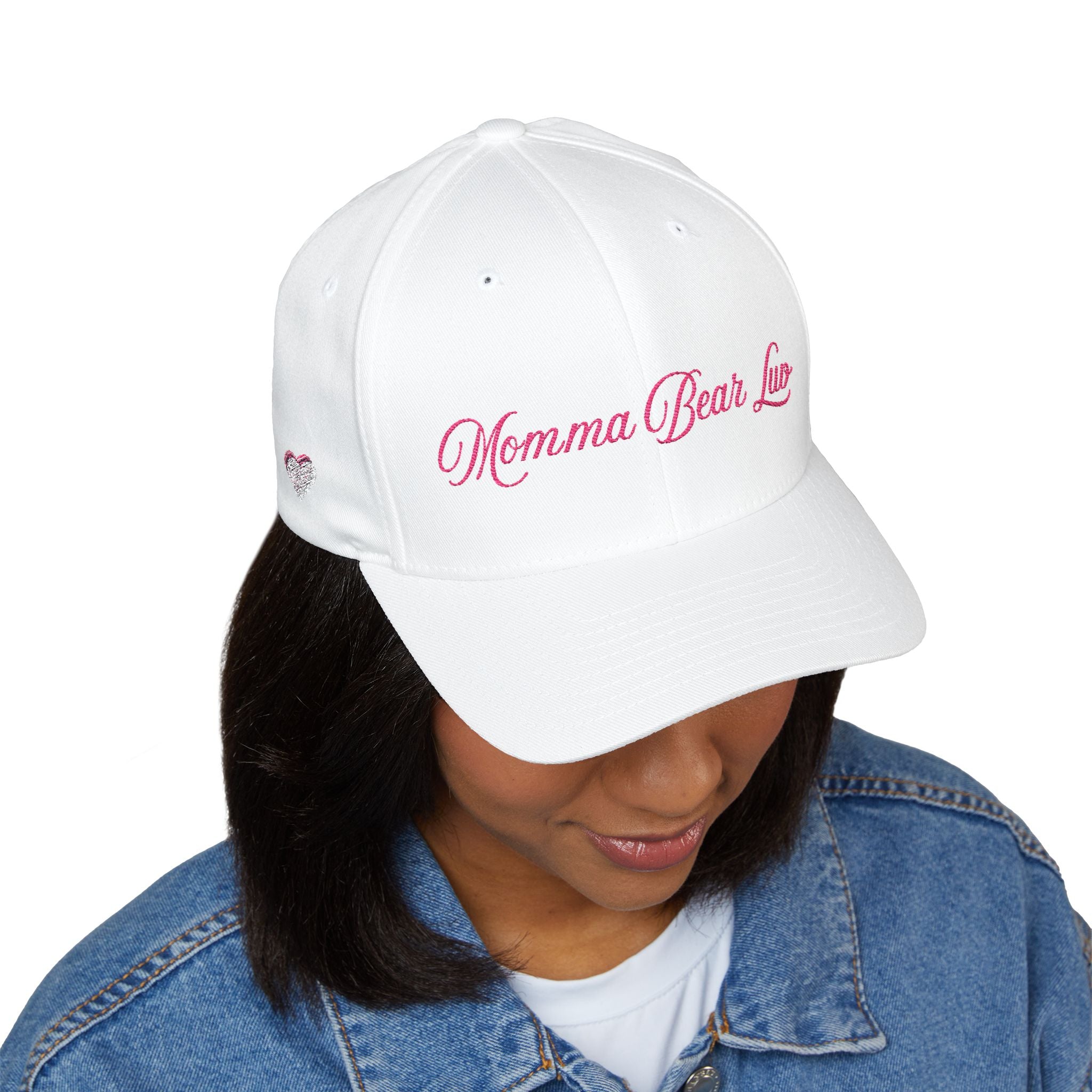 Person wearing a white baseball cap on a white background