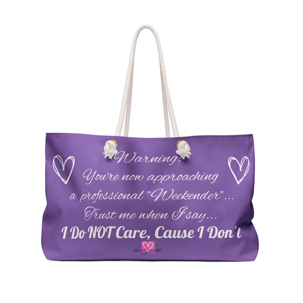 Purple tote bag with humorous text and white handles on a white background