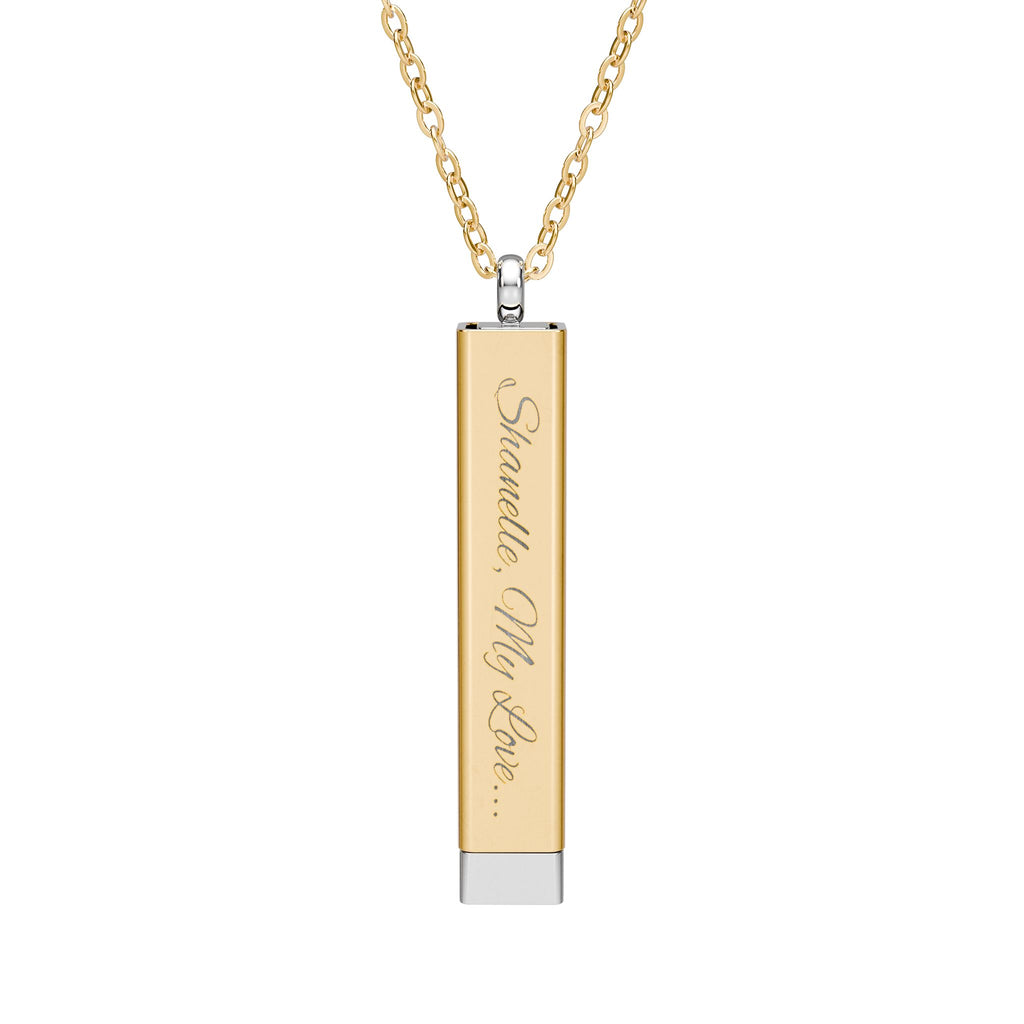 Gold secret proposal necklace with a silver insert bar engraved with words "Will You Marry Me?" on it. 
