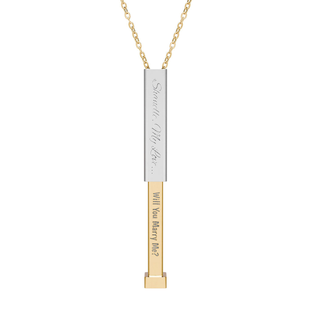 Silver secret proposal necklace with a gold insert bar engraved with words "Will You Marry Me?" on it. 