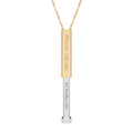 Gold secret proposal necklace with a silver insert bar engraved with words "Will You Marry Me?" on it. 