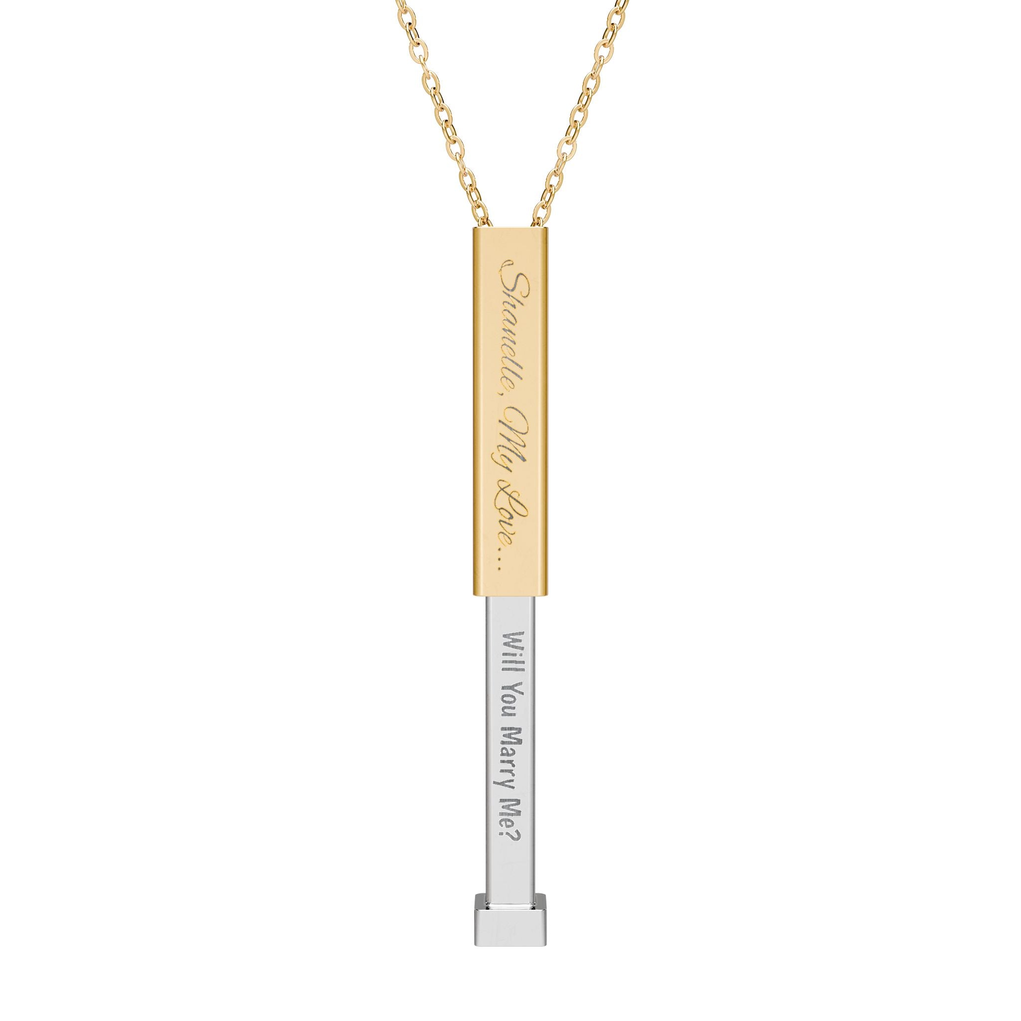 Gold secret proposal necklace with a silver insert bar engraved with words "Will You Marry Me?" on it. 